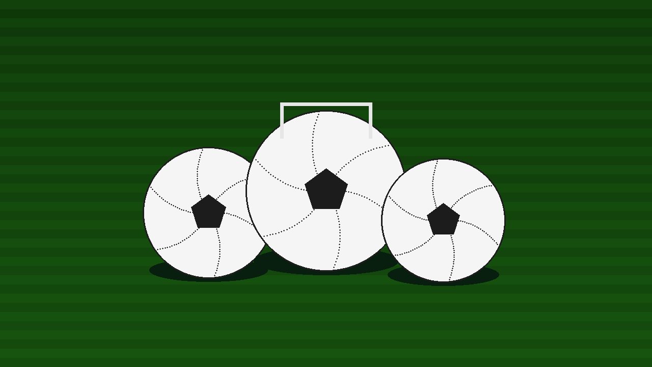 Classic footballs on a pitch